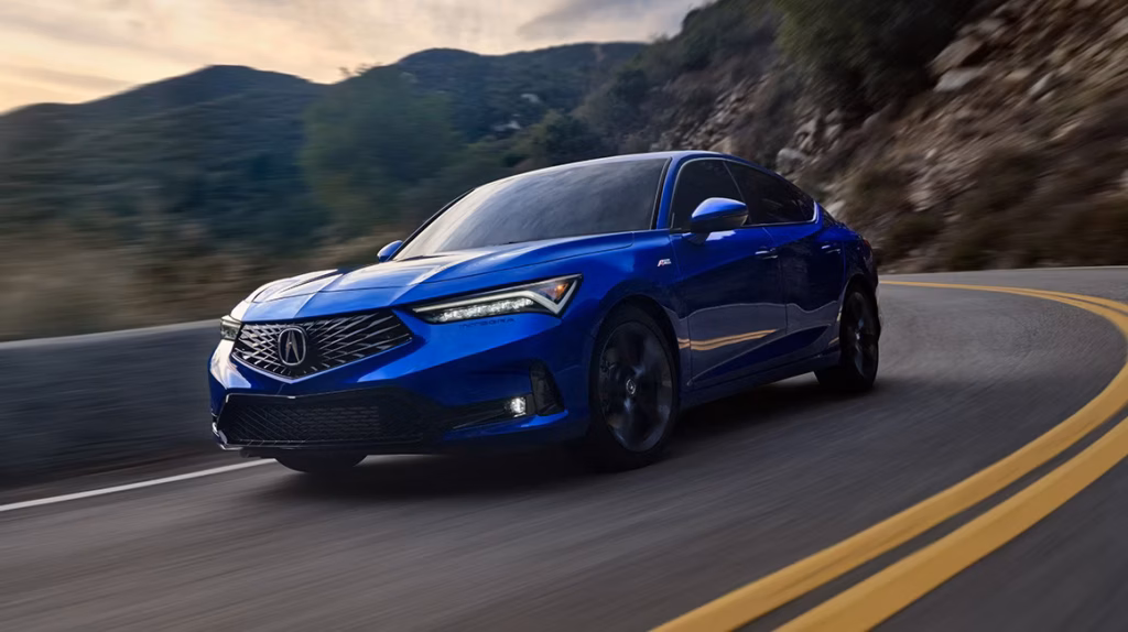 Acura Integra in striking blue color, navigating a winding road, emphasizing the quality and performance of OEM-certified auto body repairs at DB Orlando Collision.