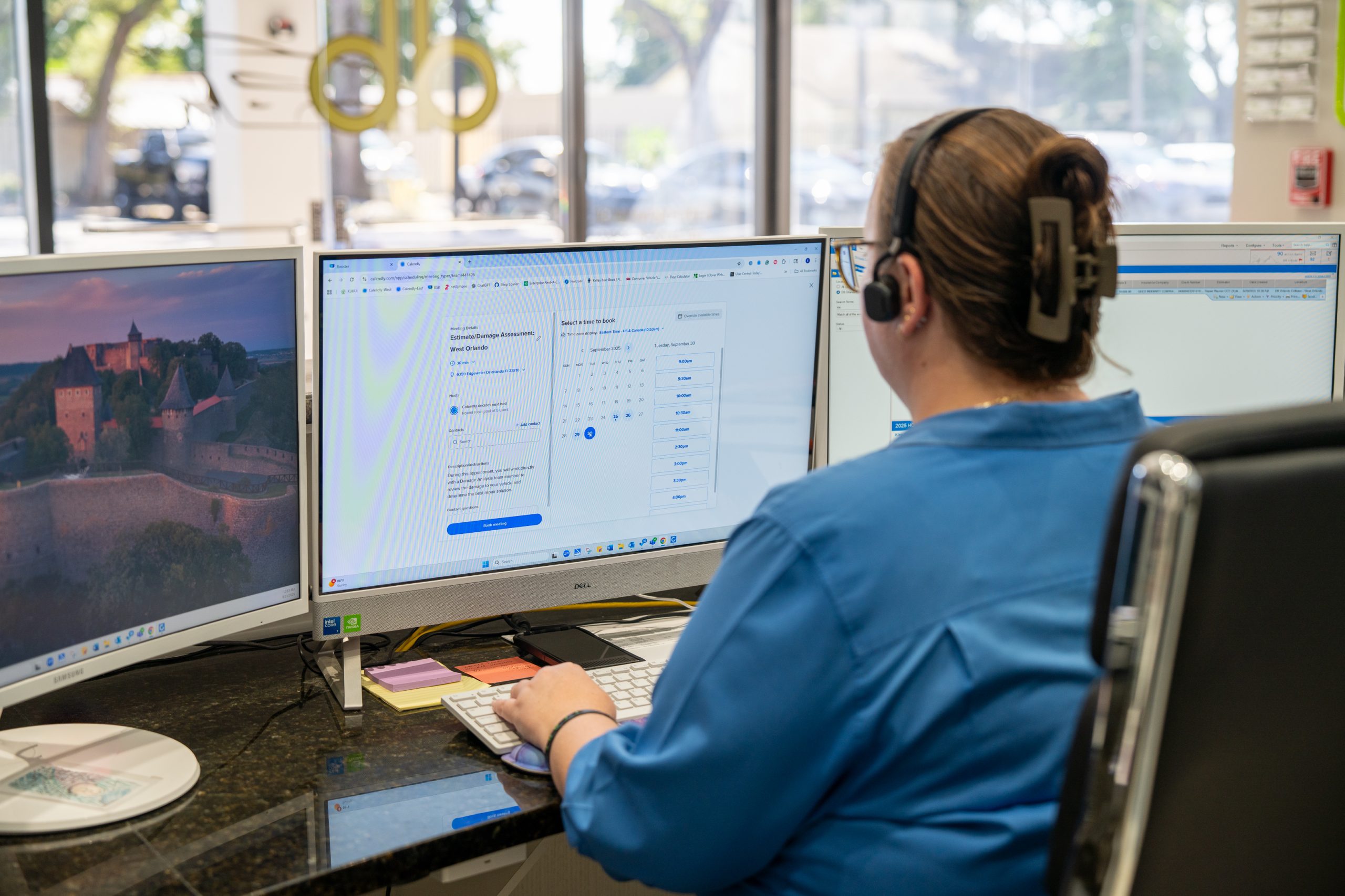 db Orlando Collision staff member scheduling a collision repair estimate in Orlando, FL