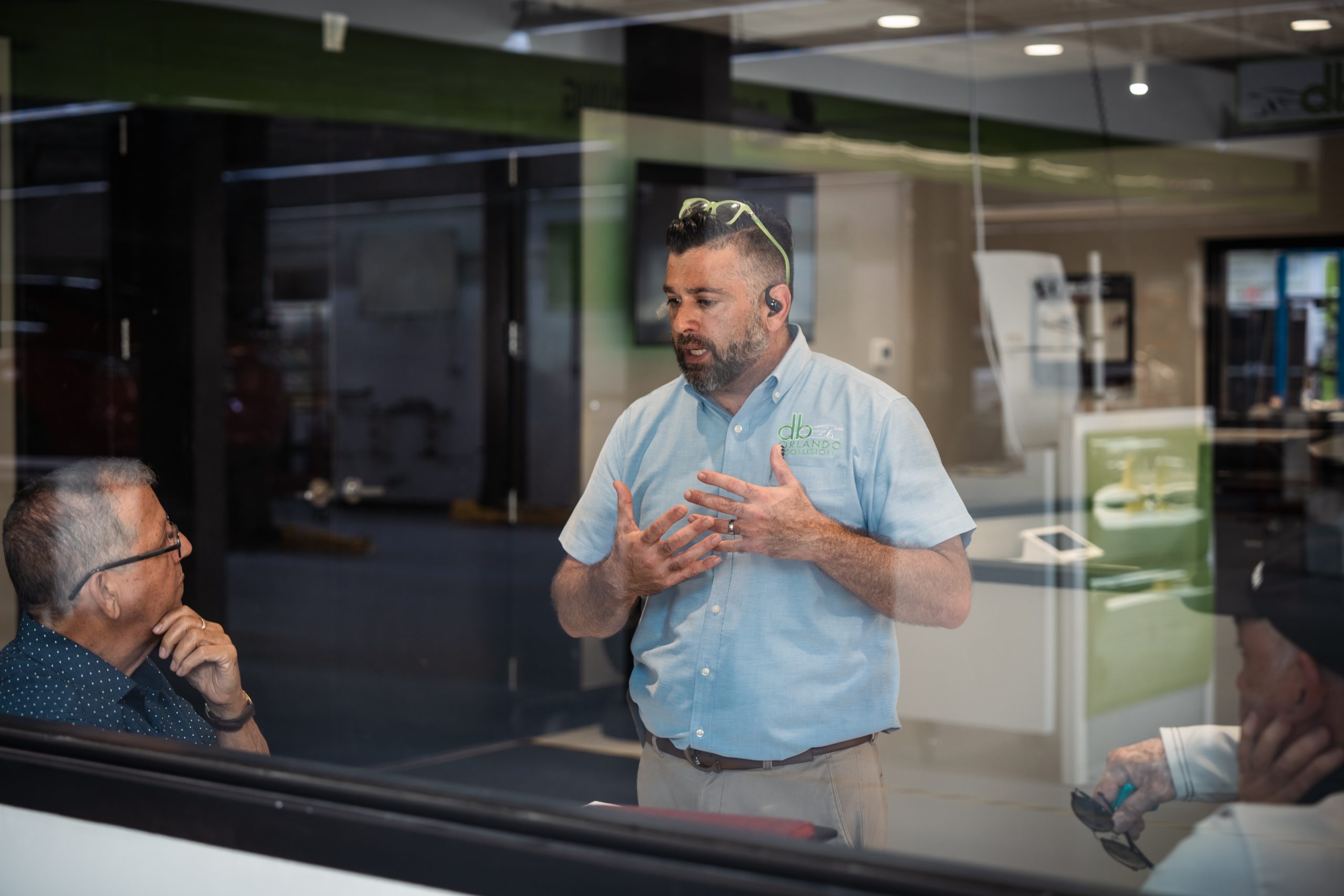 db Orlando Collision staff member educating customers about their collision repair and autobody repair rights in Orlando, FL