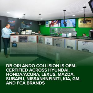 Auto body repair shop interior at db Orlando Collision showcasing OEM certifications for various car brands, emphasizing quality collision repair services.