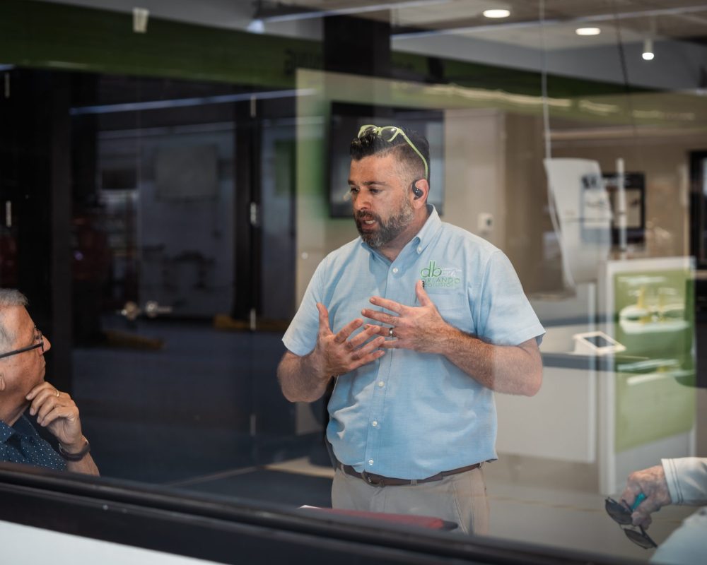 db Orlando Collision staff member educating customers about their collision repair and autobody repair rights in Orlando, FL